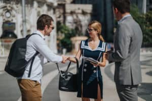 Mexican people greeting handshake street