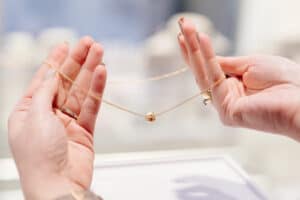 traveler removing jewelry airport line