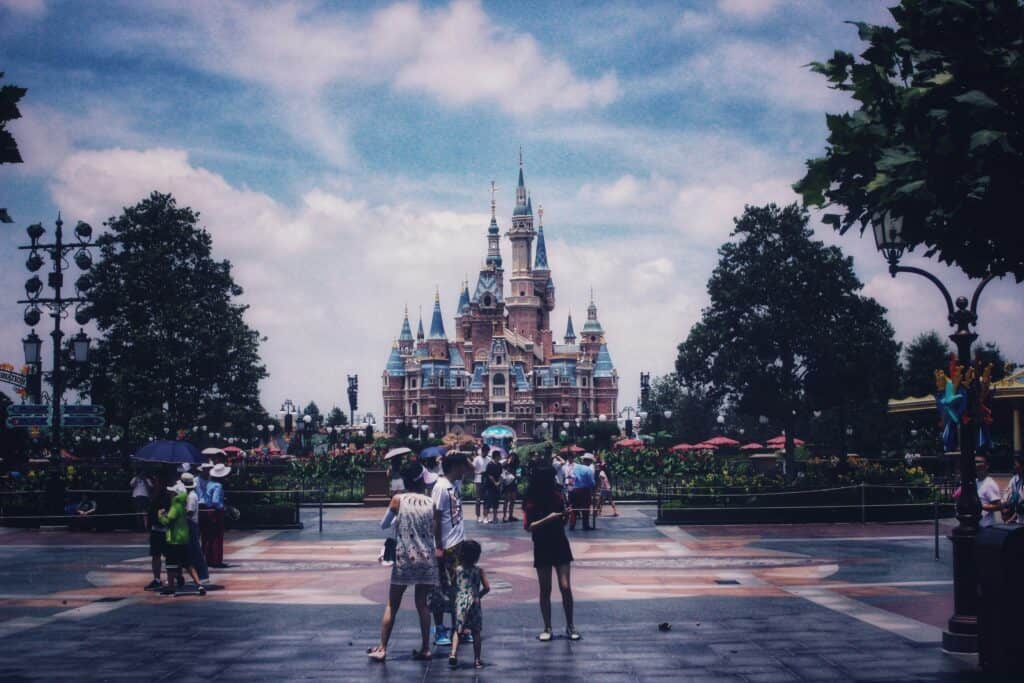 family enjoying Disney ride together happy