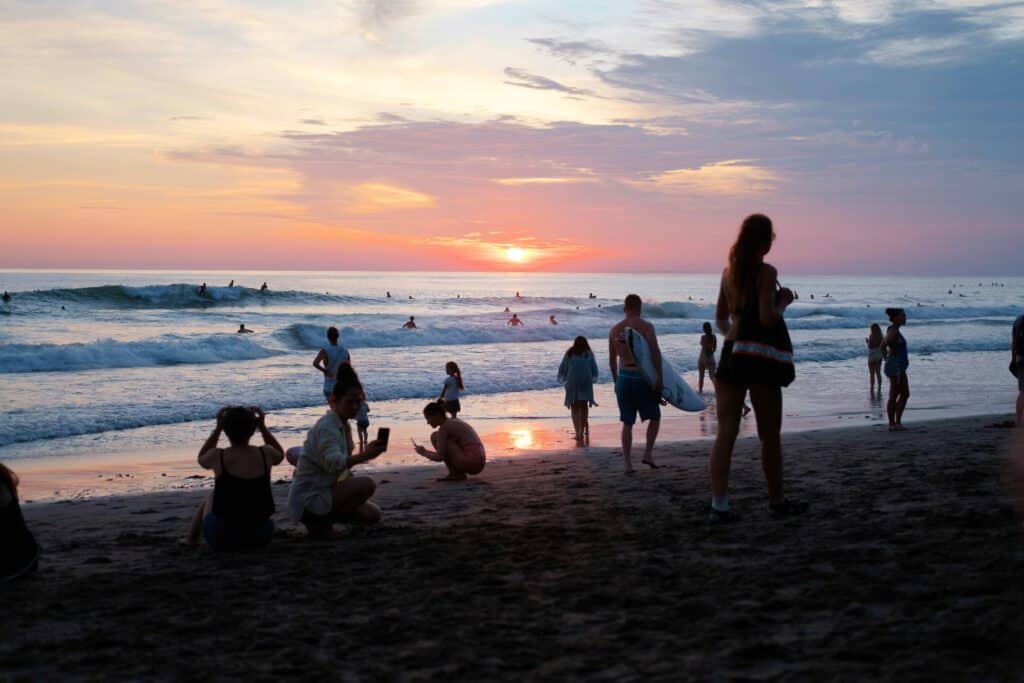 Bali beach sunset surfers Indonesia
