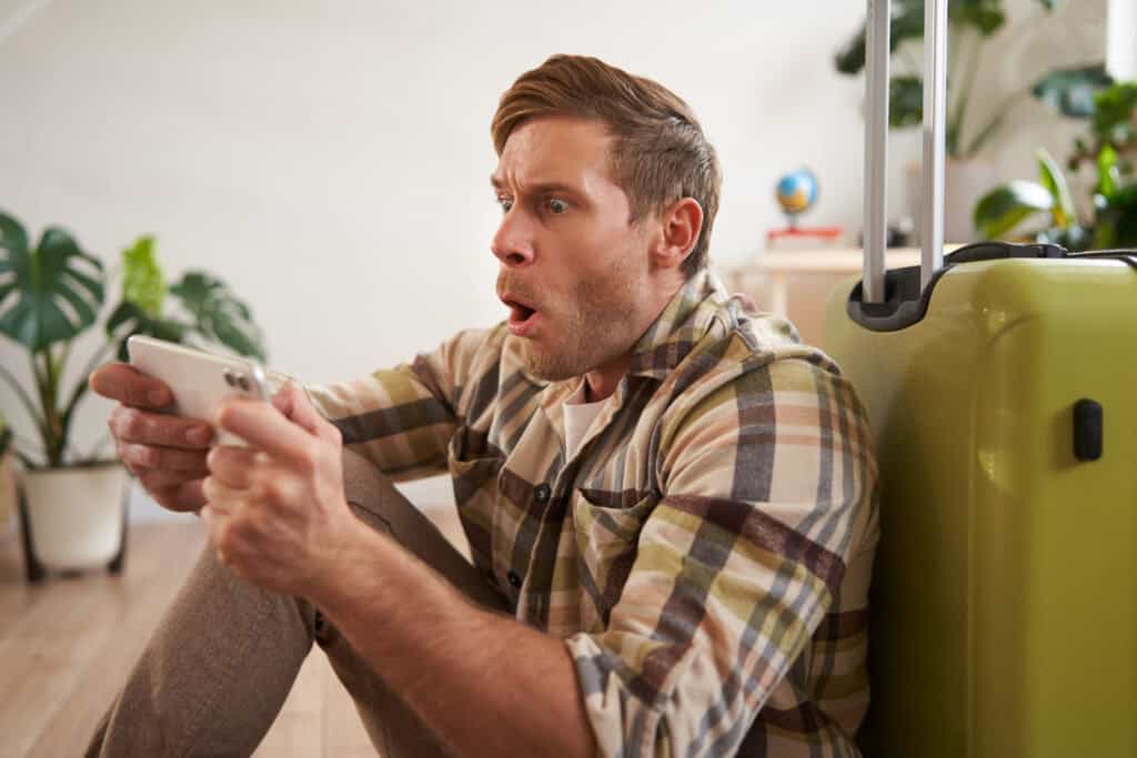 dad reacting to expensive Disney vacation bill