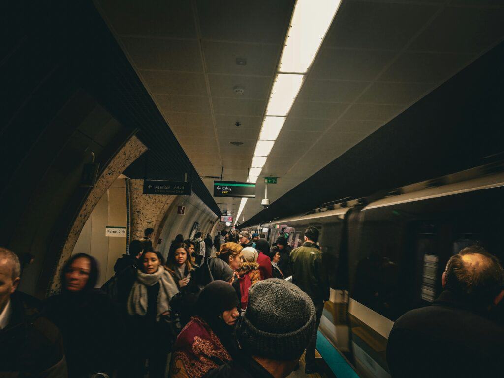 crowded metro platform Spain tourists