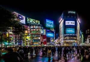 Shibuya crossing Tokyo night neon crowd