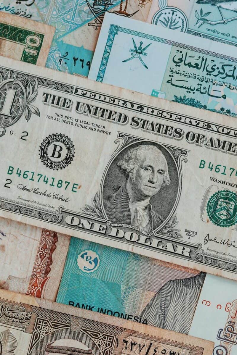 Top view of assorted paper money with American greenback representing image of President and numbers with words and signature on bill