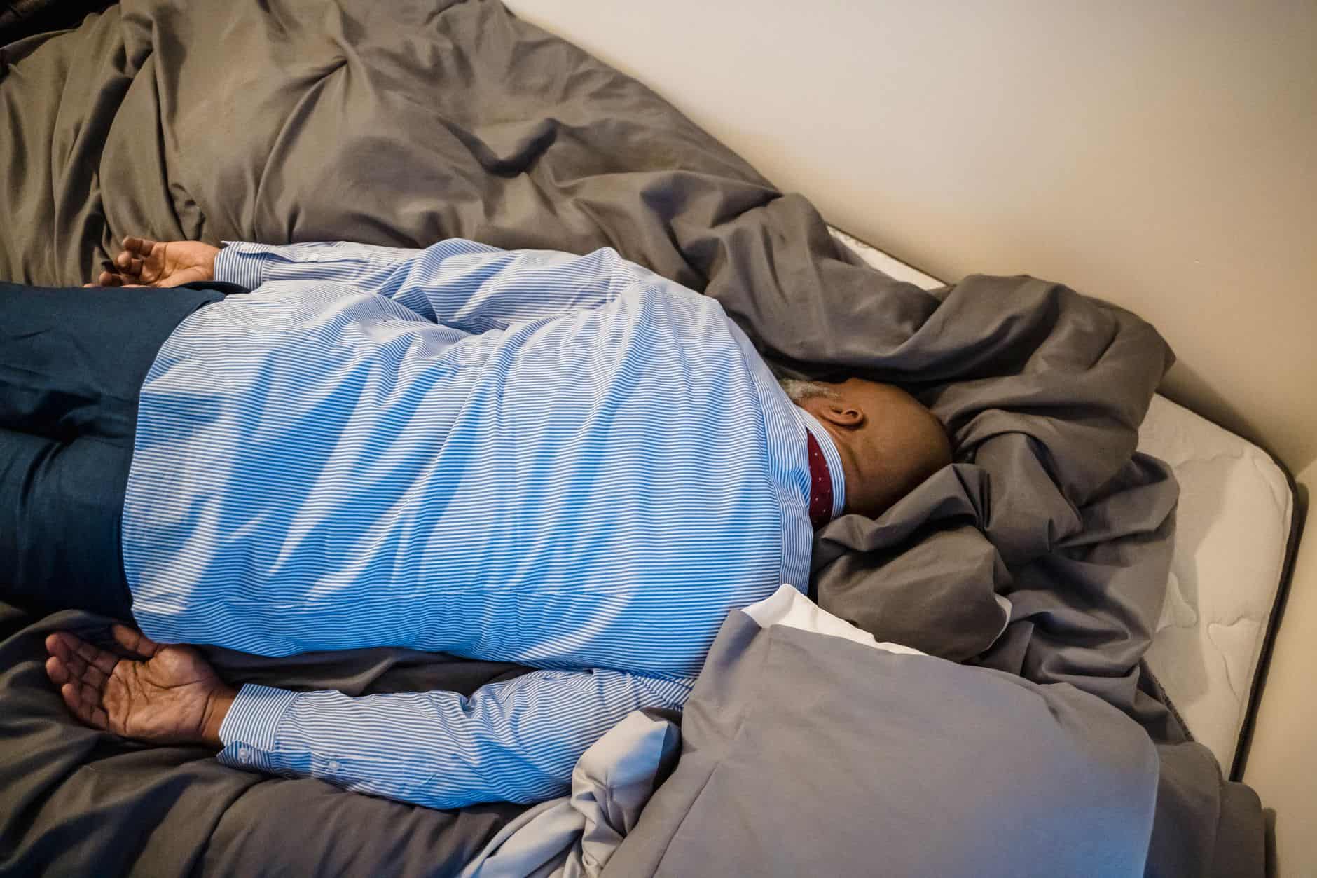 exhausted traveler bed