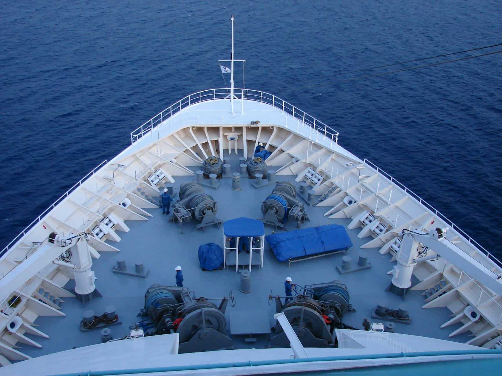 High-angle view of a cruise ship's bow against the deep blue ocean near Limassol.