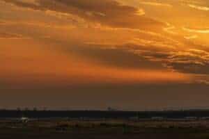 Captivating view of an airplane on the runway during a golden sunset, highlighting the beauty of aviation.