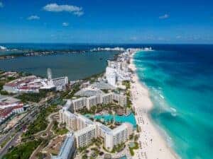 Stunning aerial view of Cancun's beachfront resorts along the vibrant turquoise waters.