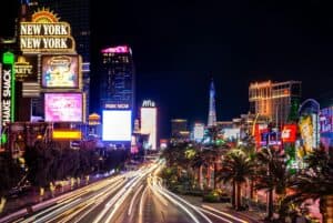 Experience the vibrant neon lights and nightlife of the iconic Las Vegas Strip at night.