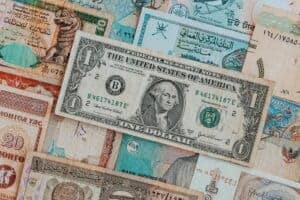 Top view of assorted paper money with American greenback representing image of President and numbers with words and signature on bill