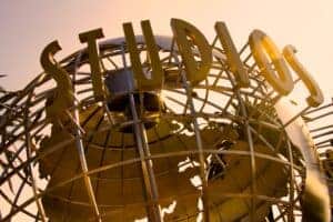 Iconic Universal Studios globe sculpture at sunset, symbolizing Hollywood magic.