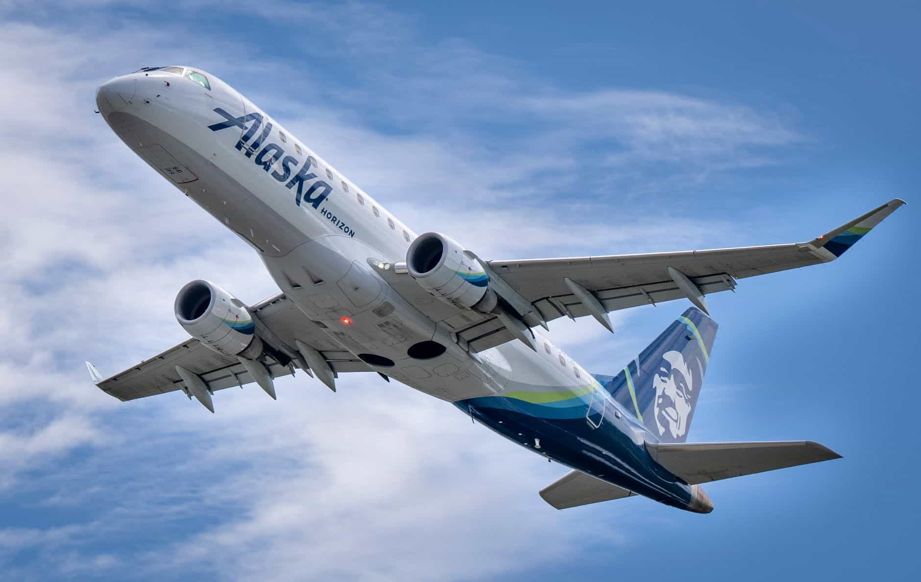 alaska airlines boeing jet taking off in seattle