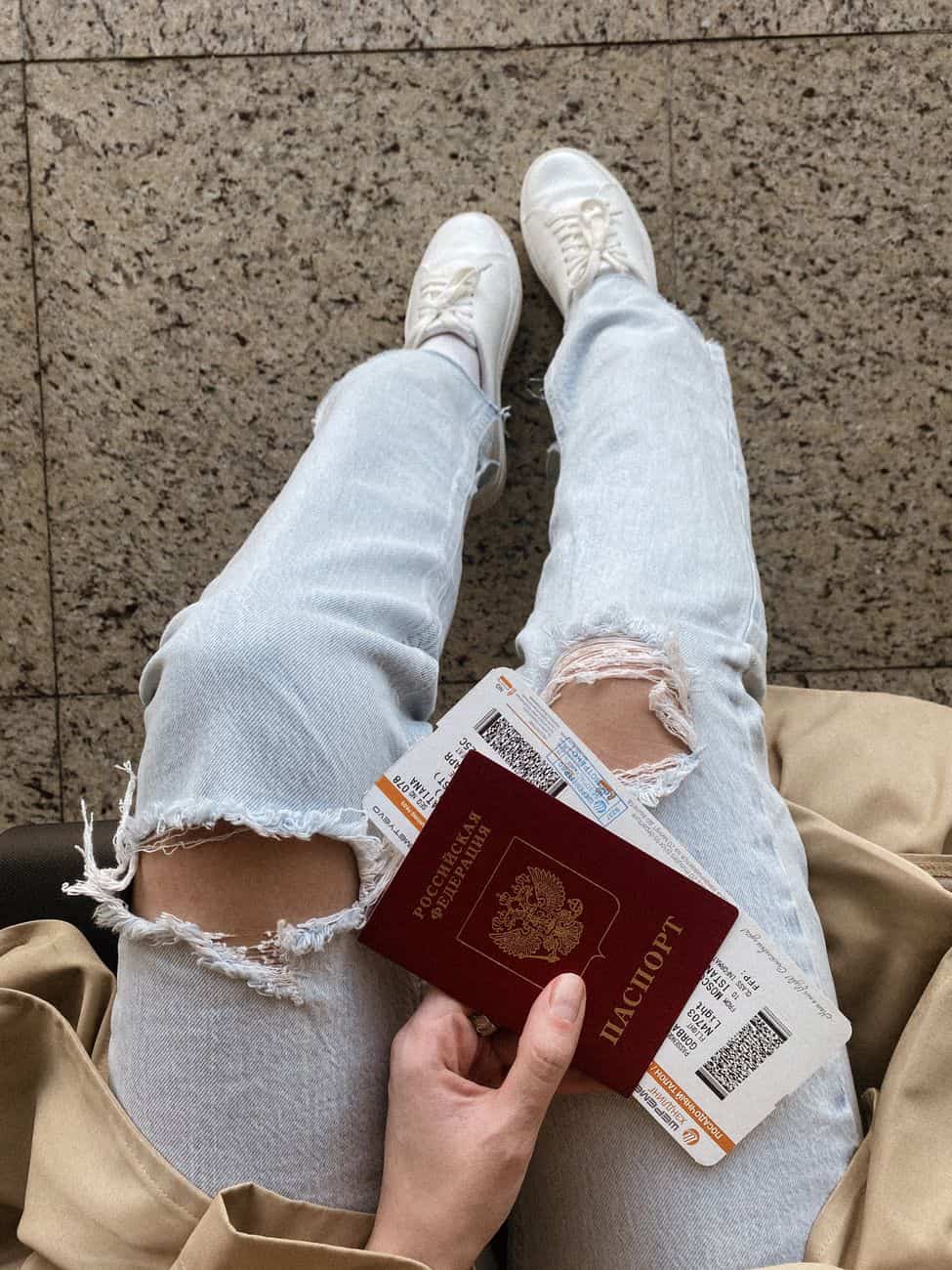 high angle shot of legs wearing white shoes