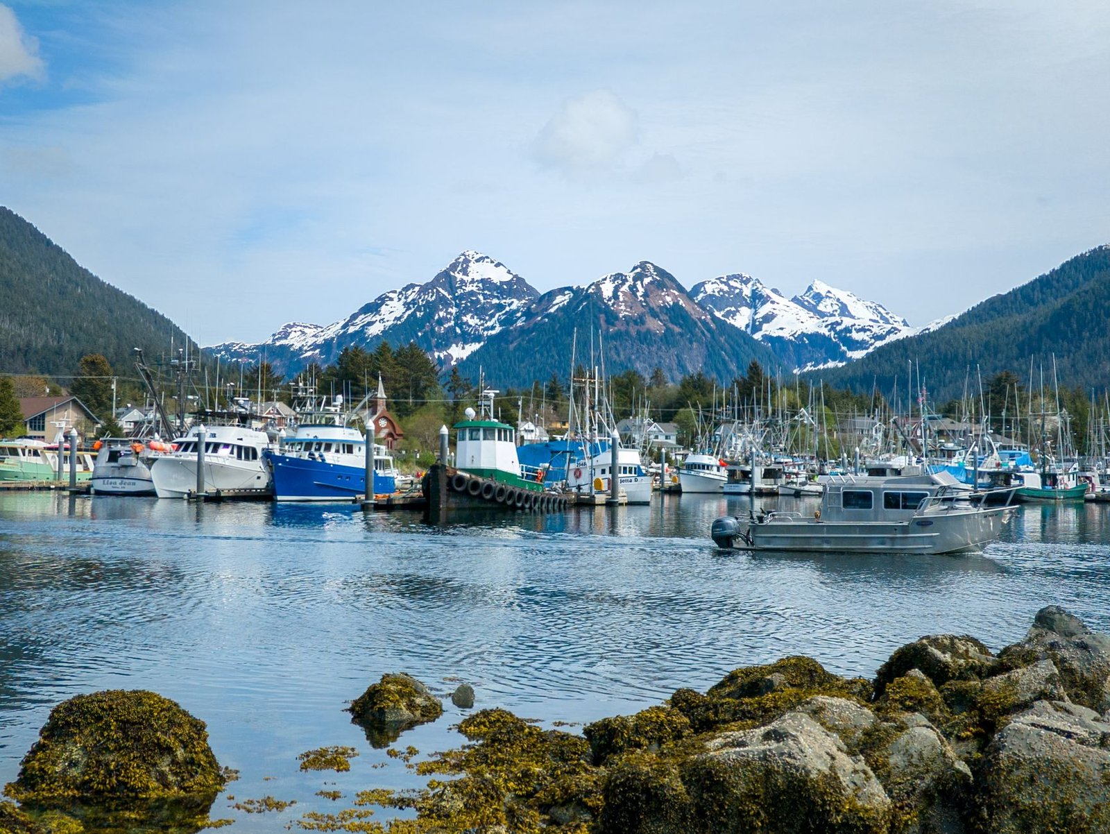 Sitka Alaska harbor with mountains and fishing boats