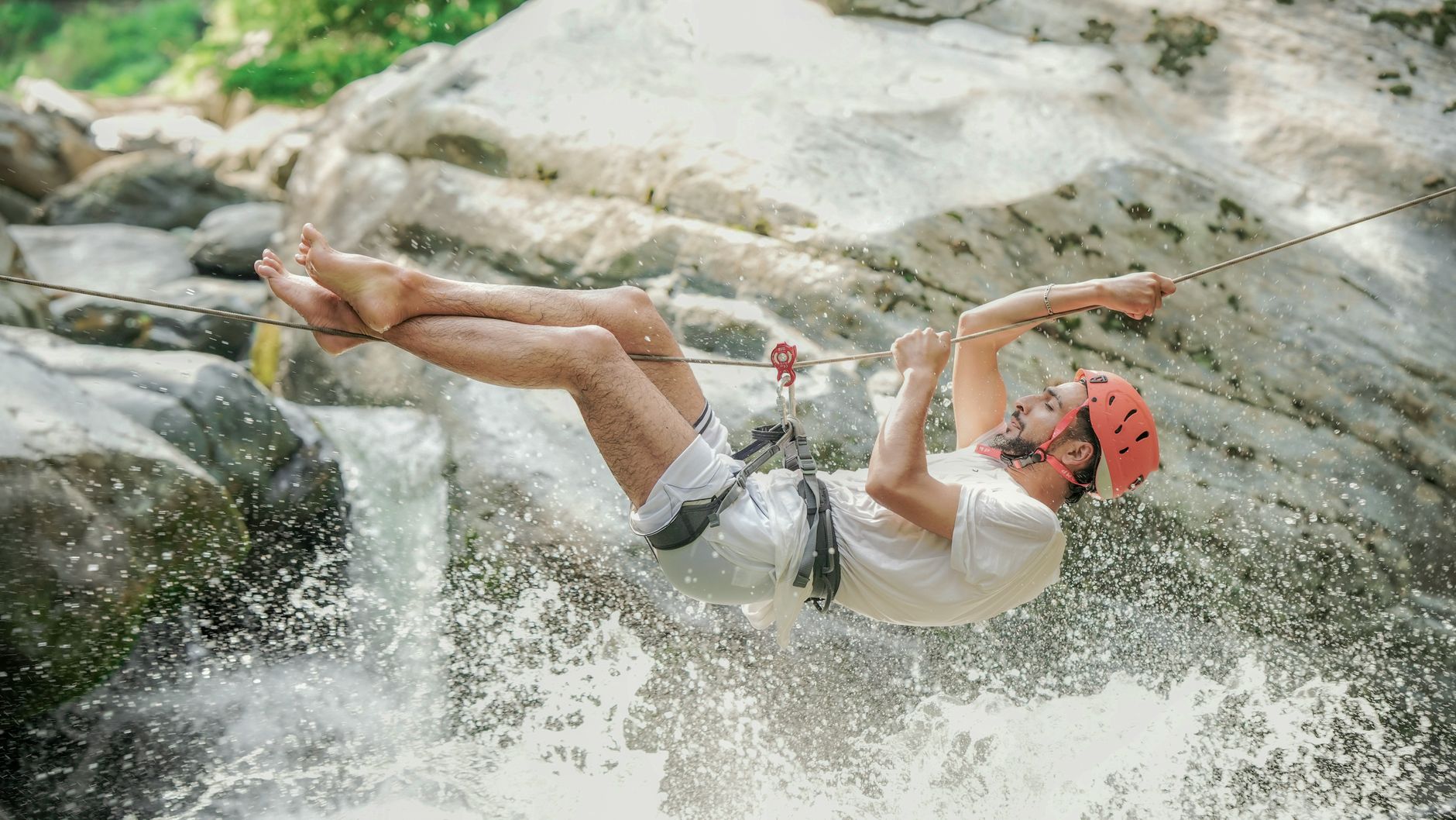 Traveler doing extreme adventure activity like ziplining