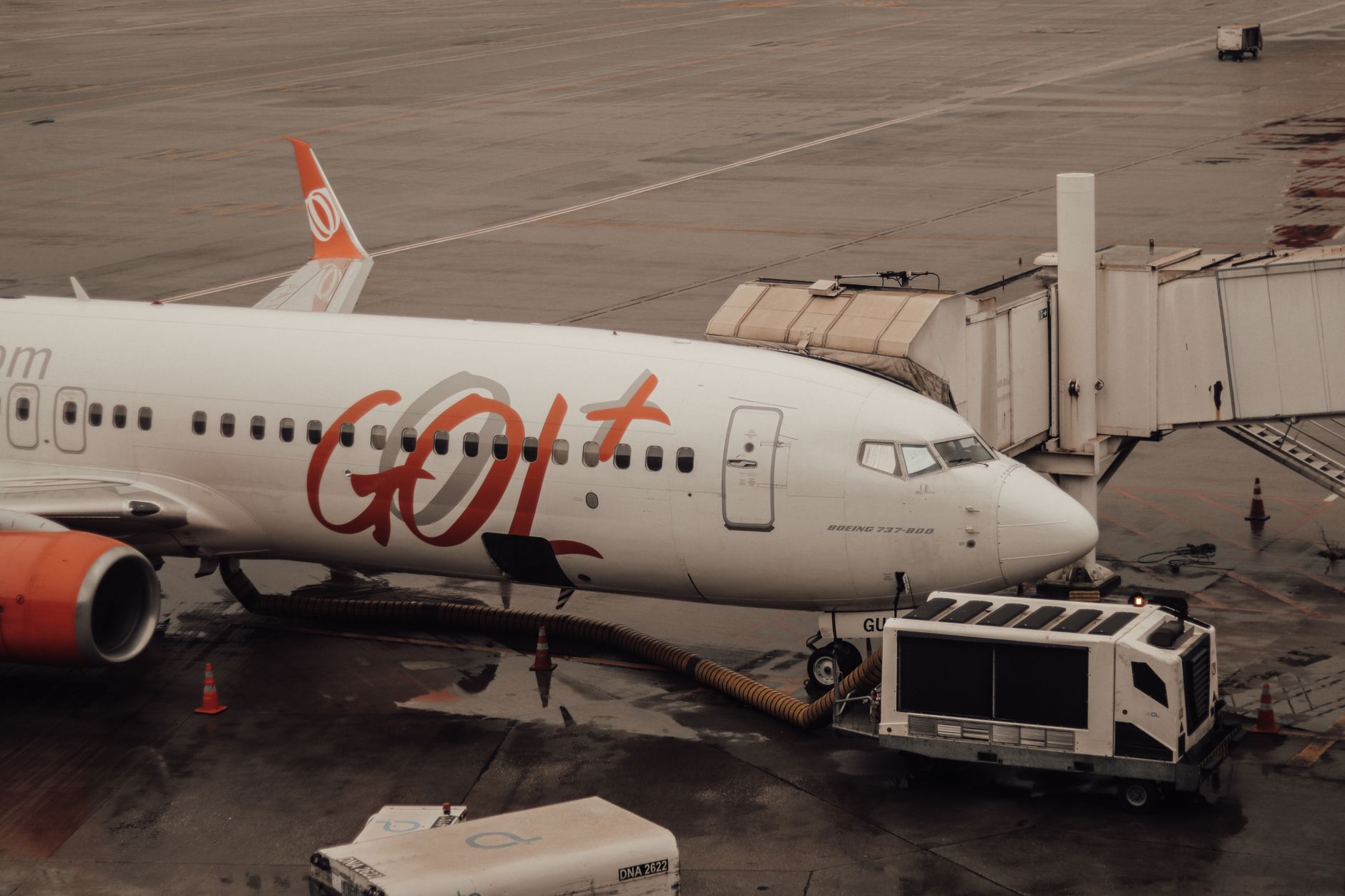 Airline gate agent processing boarding at an airport gate