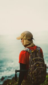 Solo traveler walking alone with backpack in unfamiliar city