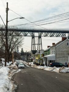Historic main street in a Hudson Valley New York town with mountains in background