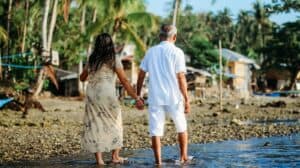 Expat retirees enjoying a cafe in a tropical retirement destination abroad