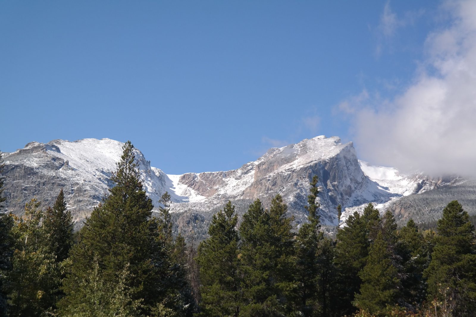 Main street in Estes Park Colorado with Rocky Mountain National Park backdrop