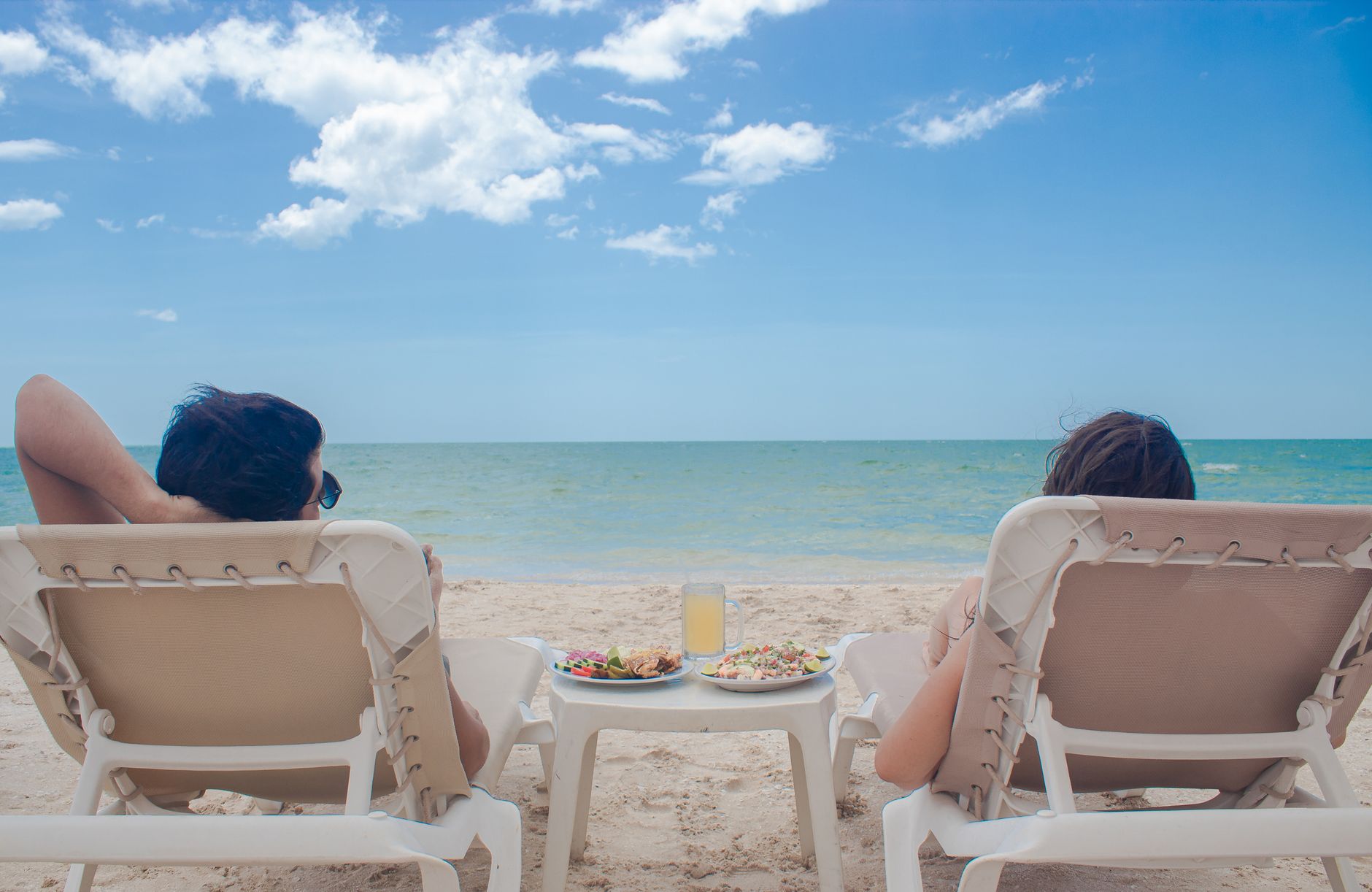 Couple relaxing at all inclusive beach resort