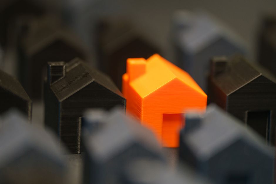 Housing price increase chart overlay on college town street