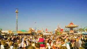 A crowded scenic viewpoint filled with tourists and photographers