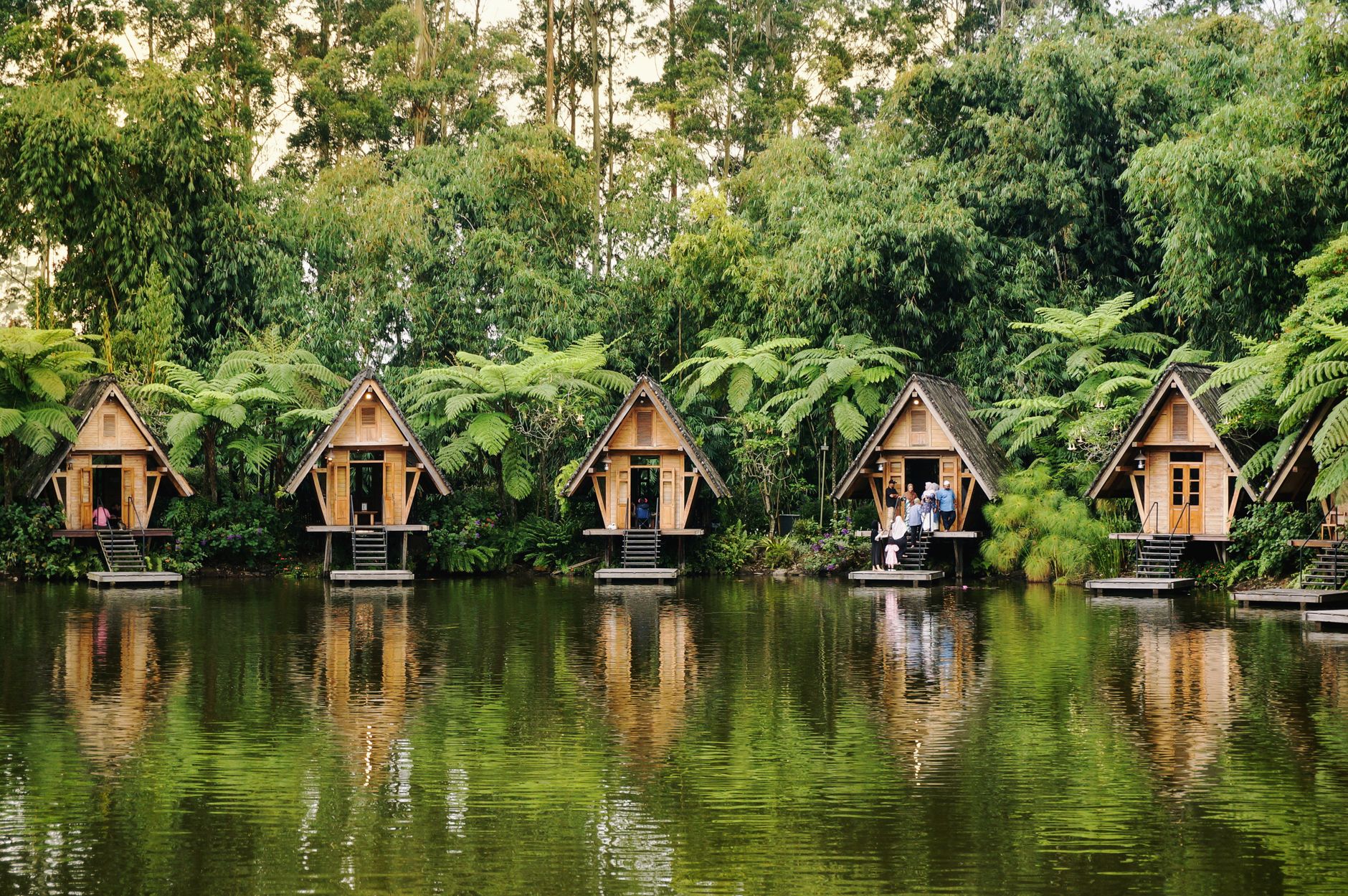 Family lake cabin with dock in summer
