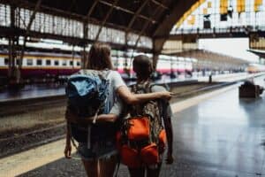 Traveler with backpack looking at city skyline