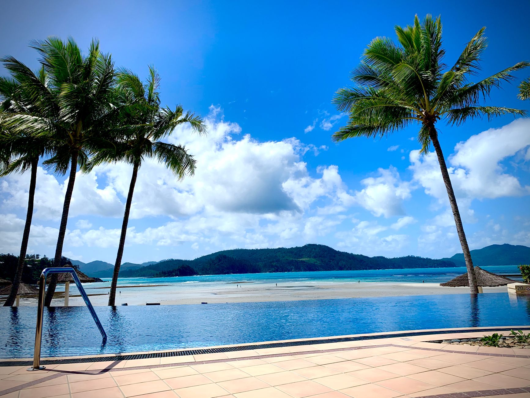 Luxury resort infinity pool photographed for social media