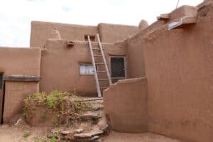 Adobe architecture with Sangre de Cristo Mountains in Taos