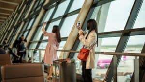 young travelers taking photos at shanghai airport