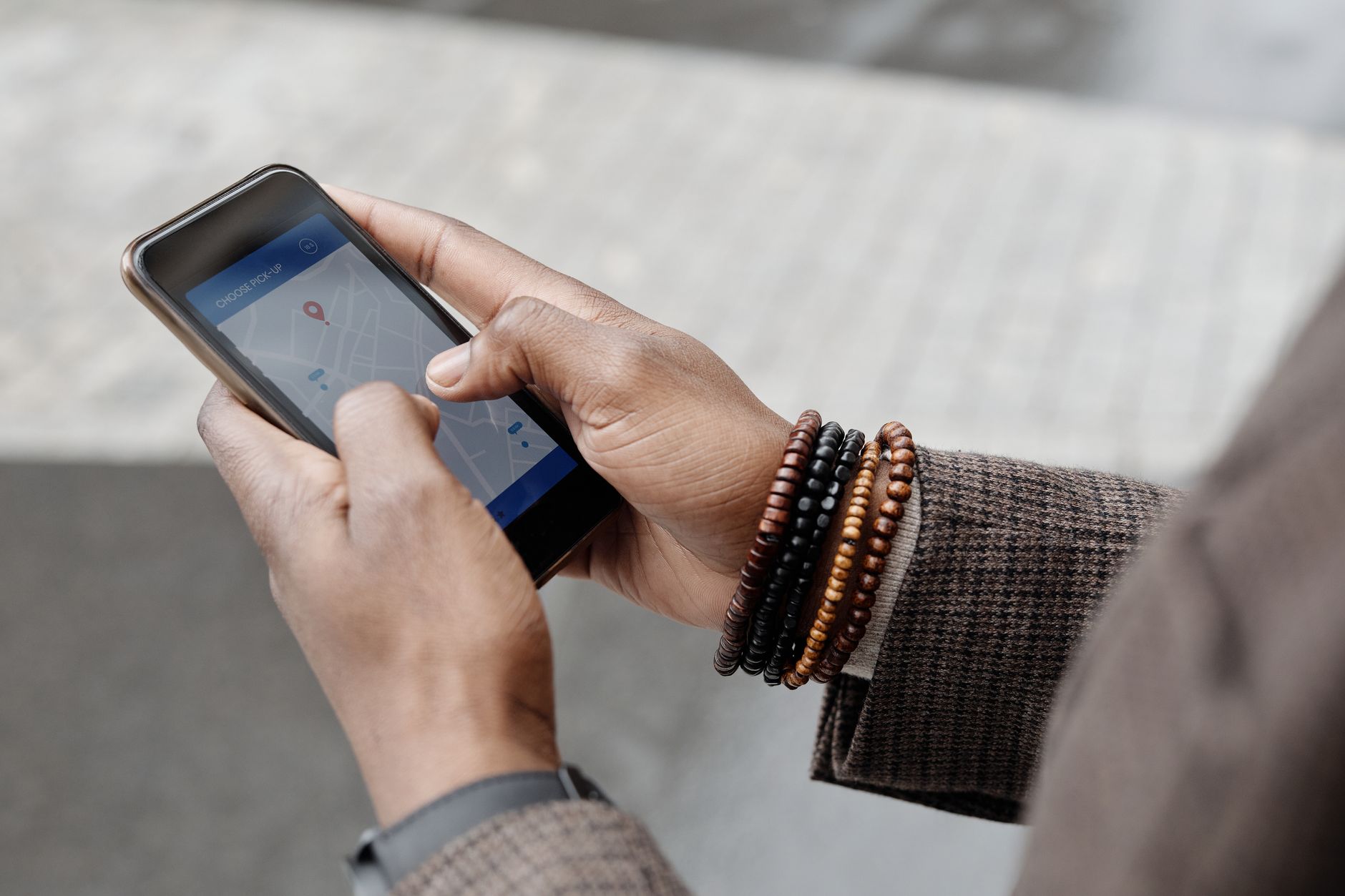 Smartphone showing a geotagged location pin on a map