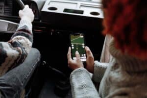 Two people disagreeing over navigation during a road trip