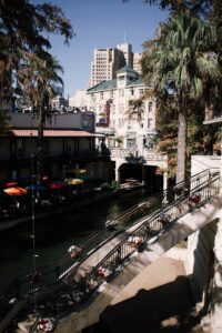 San Antonio River Walk with restaurants and river barges along the water