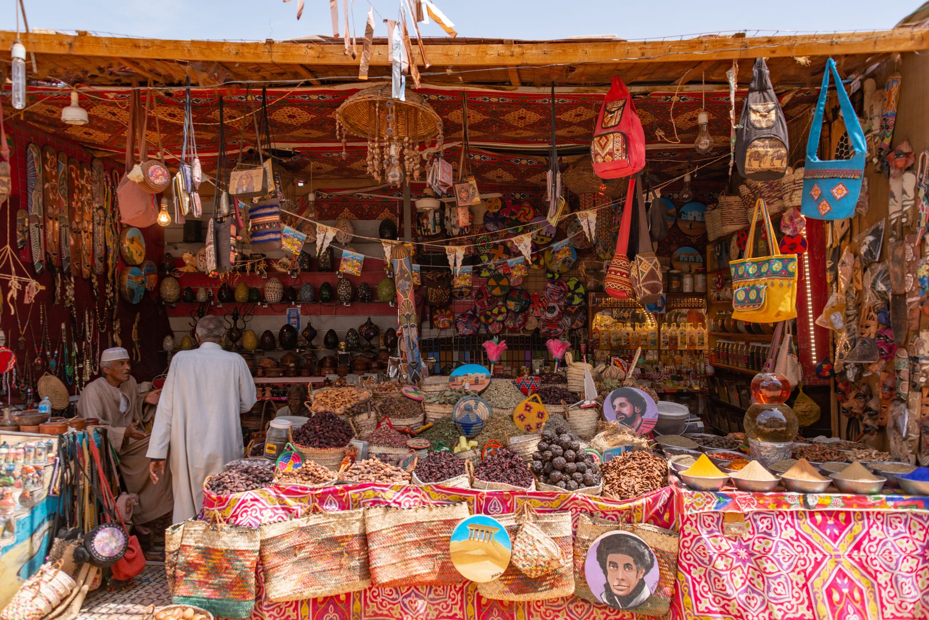 Tourist negotiating price at market stall