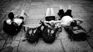 Group of friends sitting apart during a trip