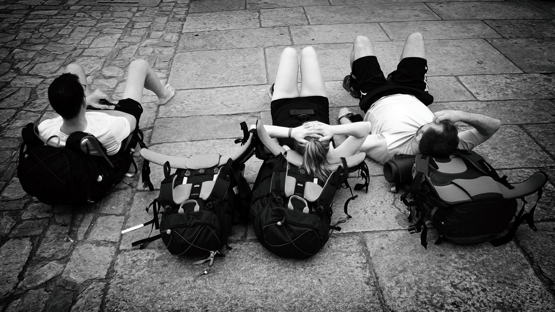 Group of friends sitting apart during a trip