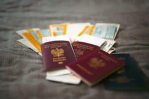 Travel insurance documents and passport on a table before a trip