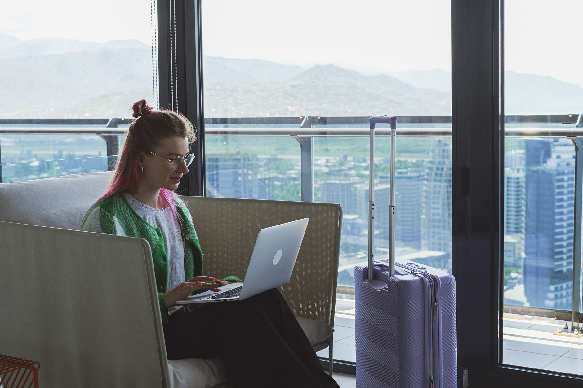 Traveler alone hotel room laptop