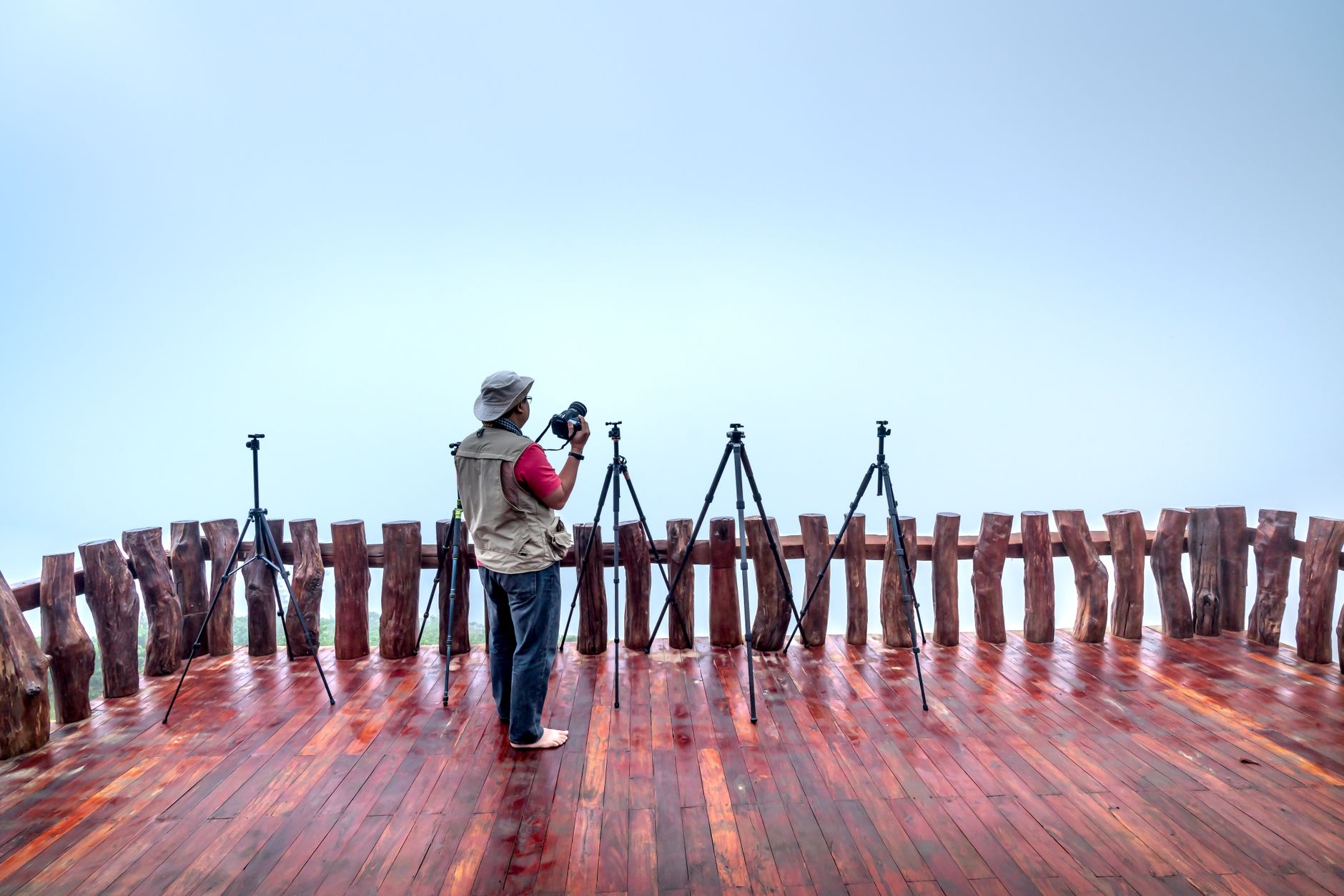 Traveler setting up shot with phone tripod