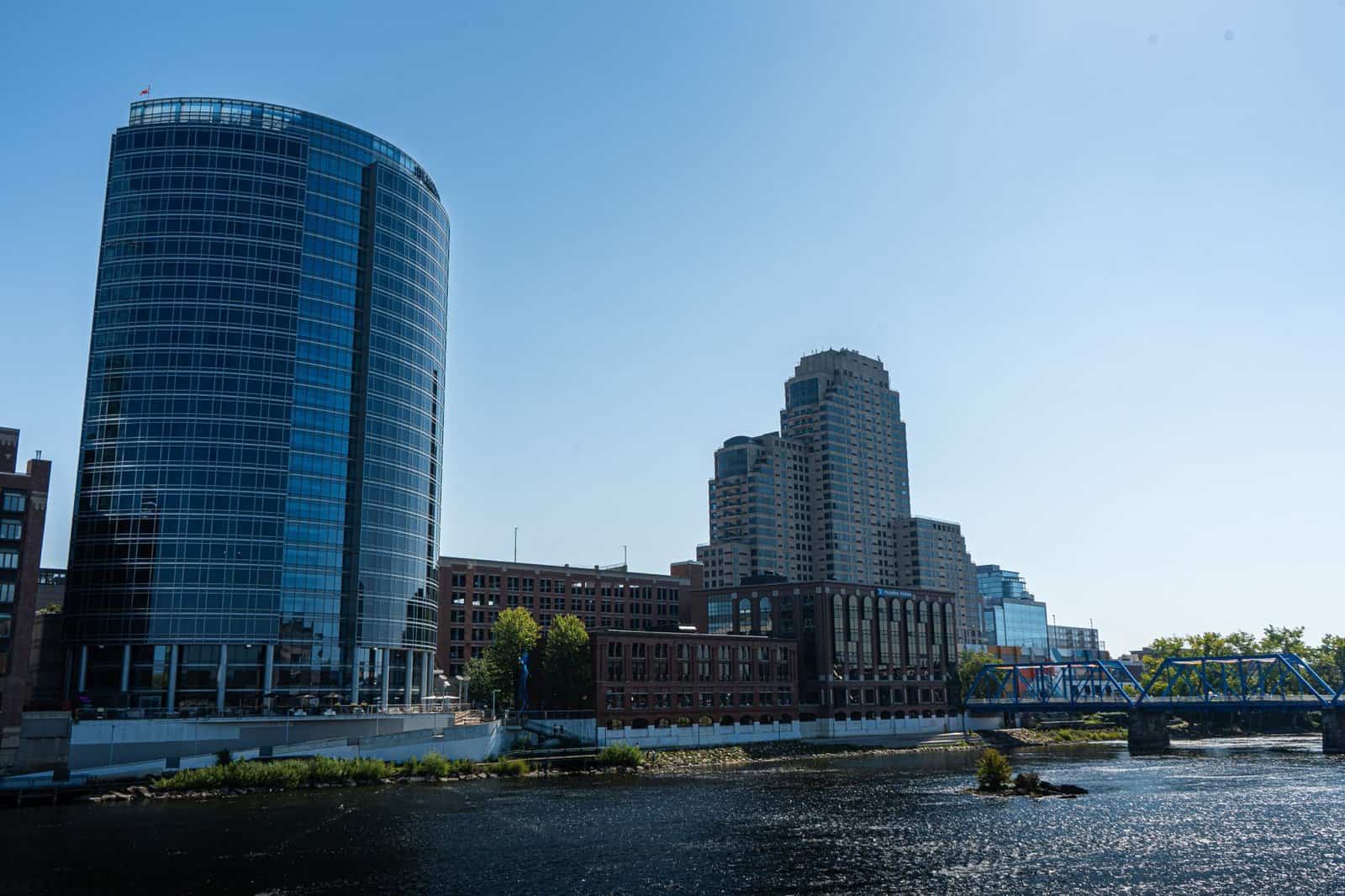 Scenic view of Grand Rapids skyline featuring the iconic Blue Bridge and modern architecture by the Grand River in Michigan.