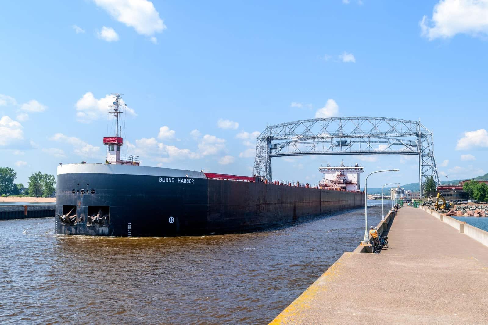 Cargo ship 'Burns Harbor' passes under the Aerial Lift Bridge in Duluth, Minnesota.