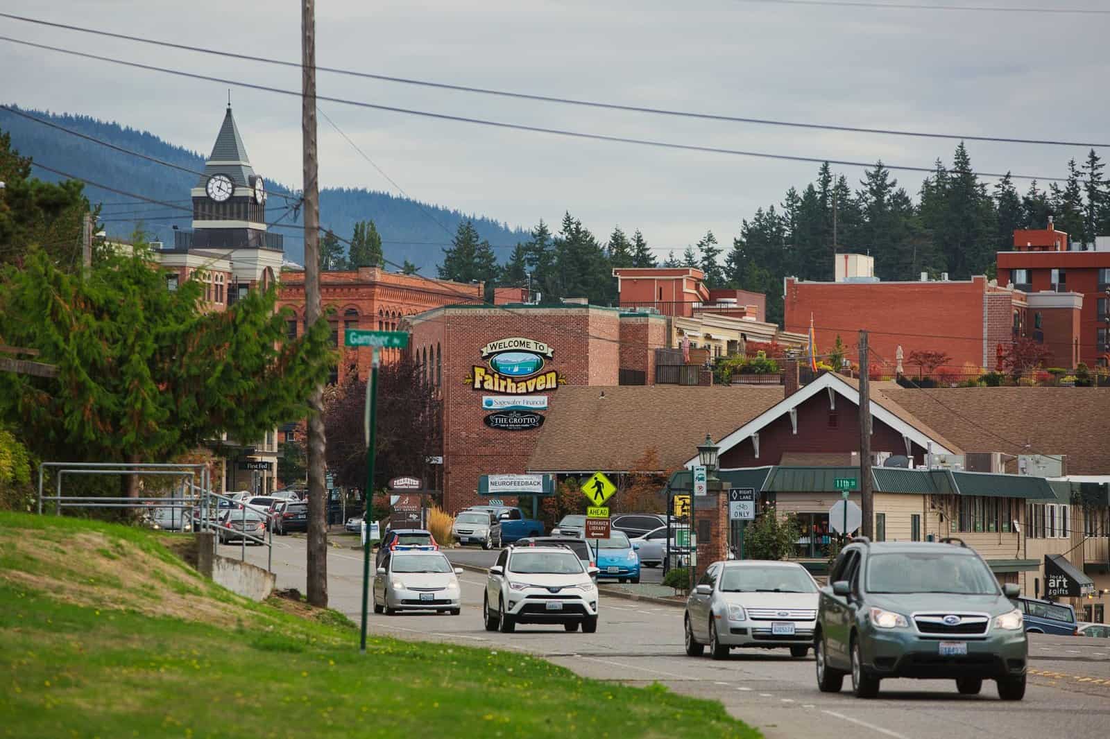 Street view of the historic Fairhaven district in Bellingham, WA with vibrant architecture and traffic.