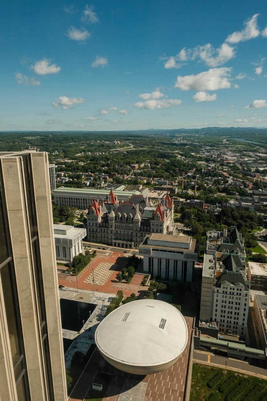 Aerial view of Albany's government buildings showcasing modern architecture and urban landscape.