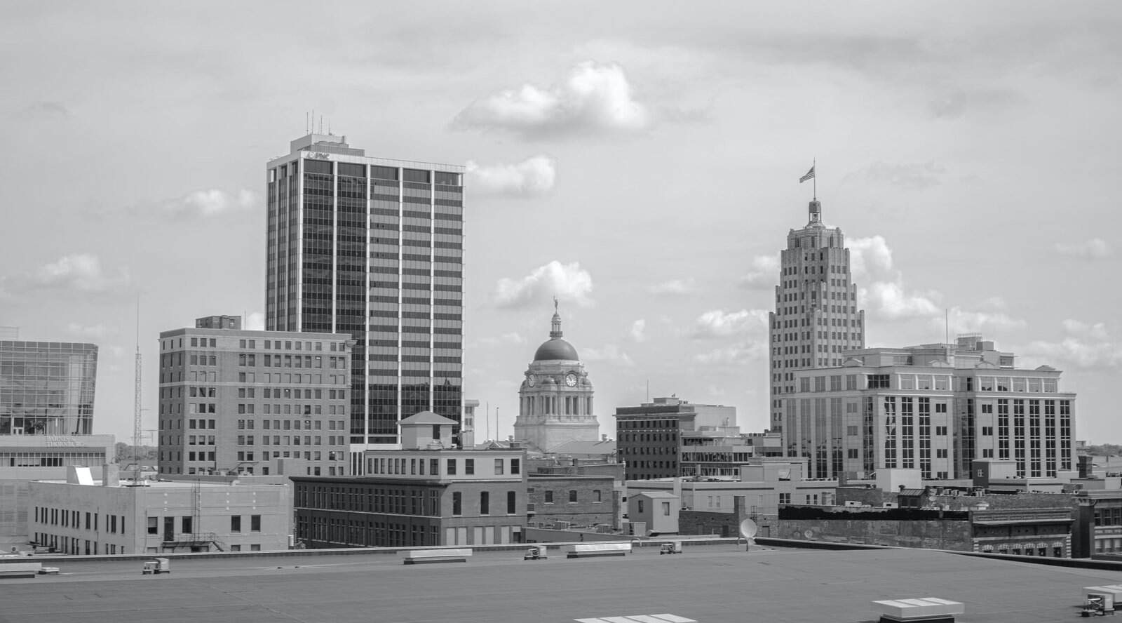Grayscale cityscape of Fort Wayne, Indiana showcasing prominent buildings and skyline.