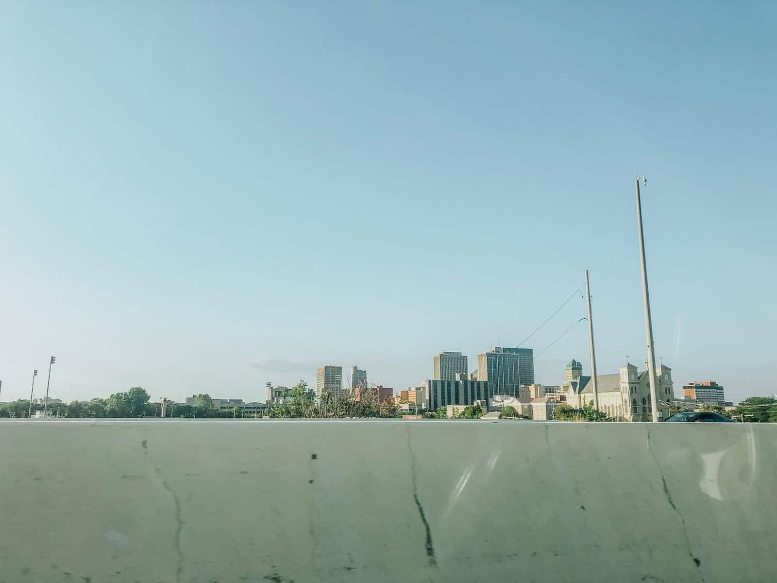 Scenic view of downtown Dayton skyline under a clear blue sky, ideal for urban landscapes.