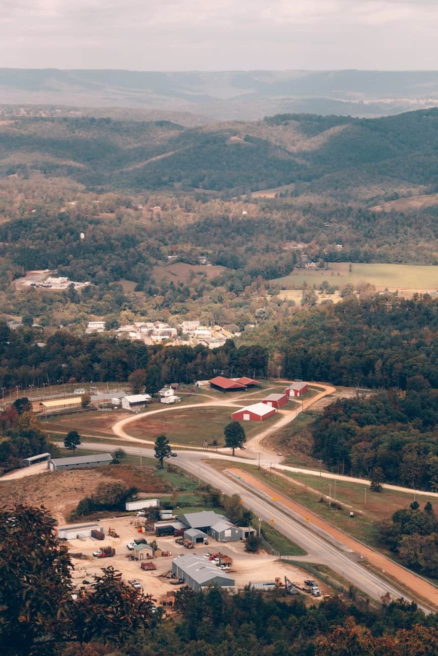 Discover the scenic hills and countryside of Arkansas captured from above during fall.