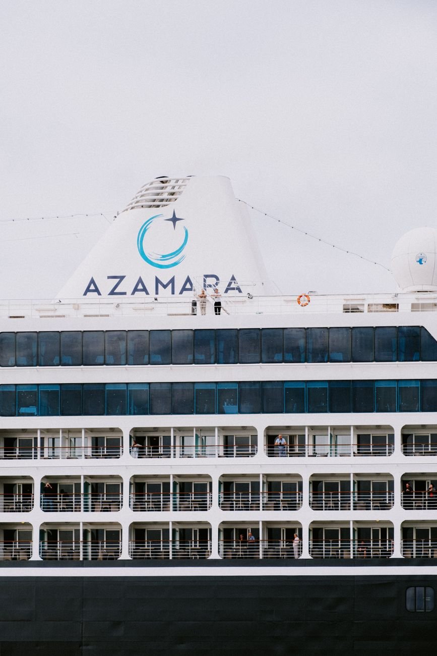 Close-up of a luxury cruise ship, highlighting balconies and elegant design. Ideal for travel and tourism content.