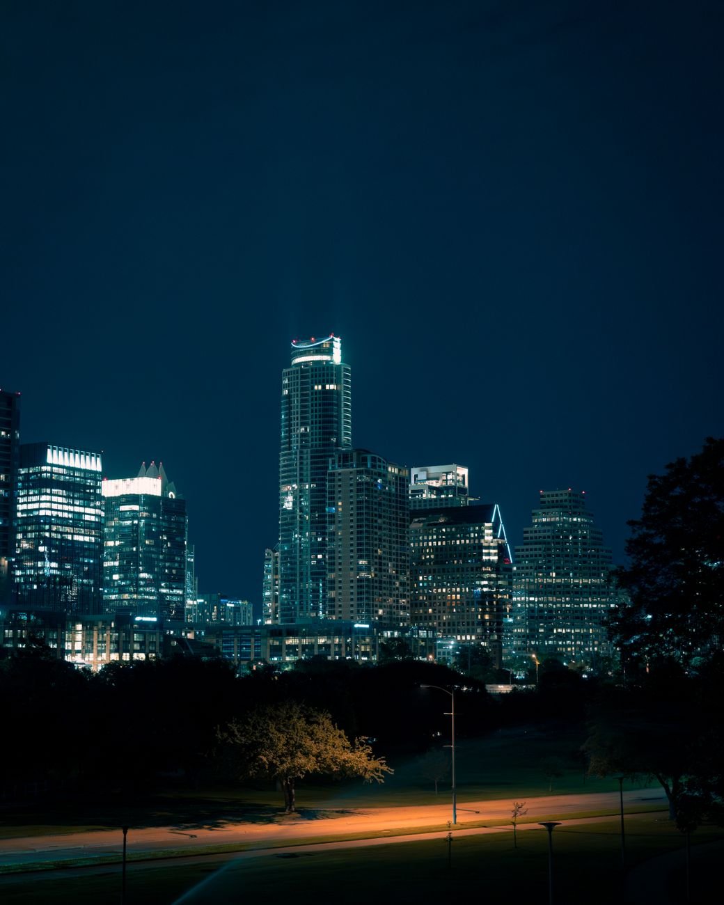 Illuminated Austin skyline showcasing vibrant skyscrapers against the night sky.